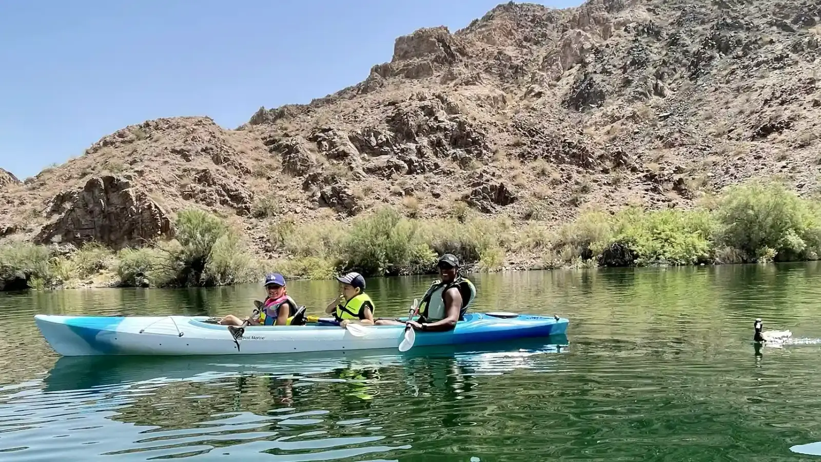 Family with children kayaking on Lake Mead