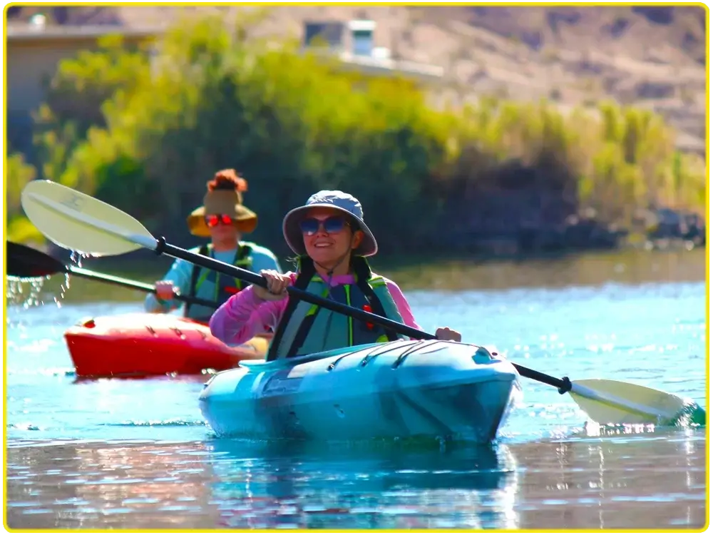 Tandem kayakers paddling near Willow Beach